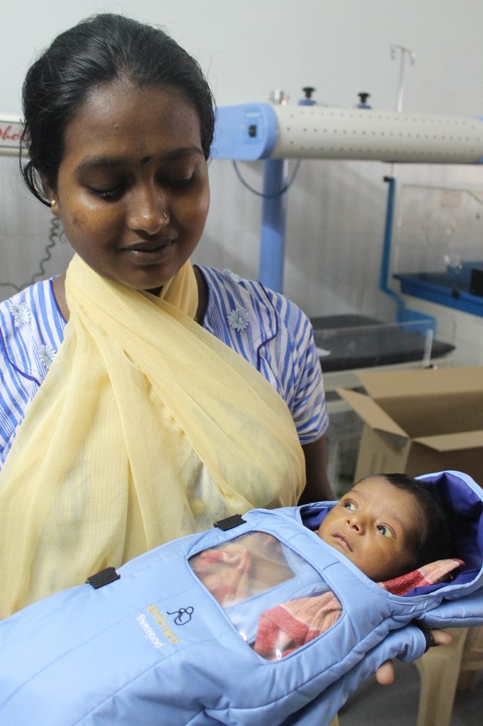 A mother bonding with her newborn infant