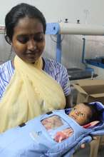 A mother bonding with her newborn infant