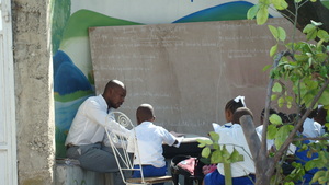 Children attending class in the open air