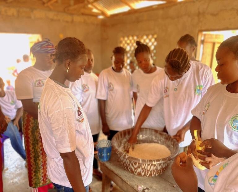 Women learning traditional method to make bread