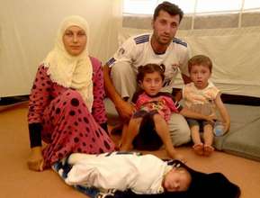 Um with her husband, children, and healthy baby