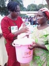 Dekoisse and her new baby receive a dignity kit