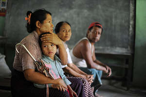 A youth volunteer, delivers supplies in Myanmar