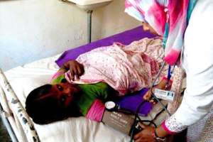 UNFPA-trained midwife examining tea garden worker