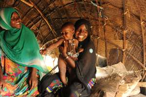 Mother and baby inside their home