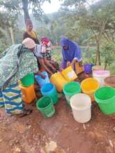 Women of Igoji Collect Water From Well