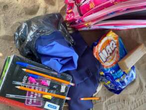 Backpack with uniform and school supplies