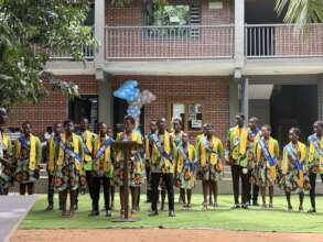 Our graduates holding a speech