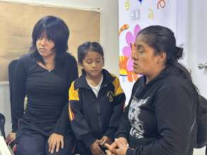 Maria with her family