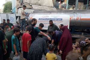 Water distribution at evacuation center in Gaza