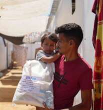 Gaza family receiving aid
