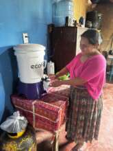 Mother preparing a meal with safe water