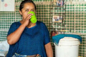 A mother is drinking safe water