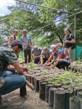 Visitors helping with the Reforestation Program