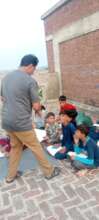 guide star team with children distributing food