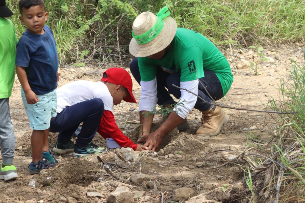 Children participate in planting