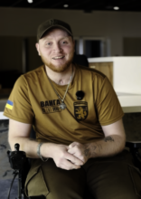 Yevhen sharing his story in an interview