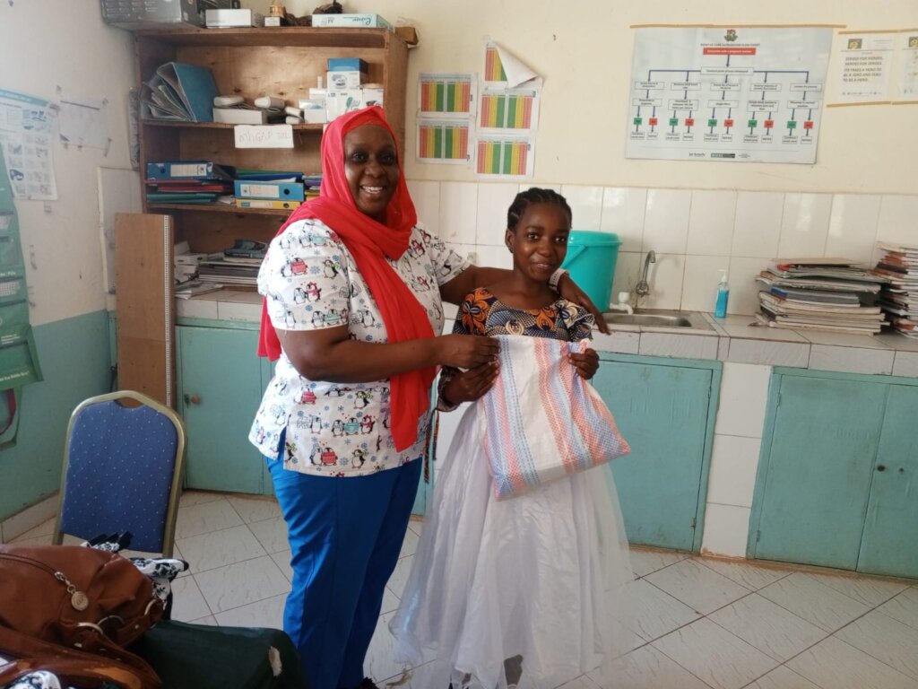Beneficiary receiving scholastic materials