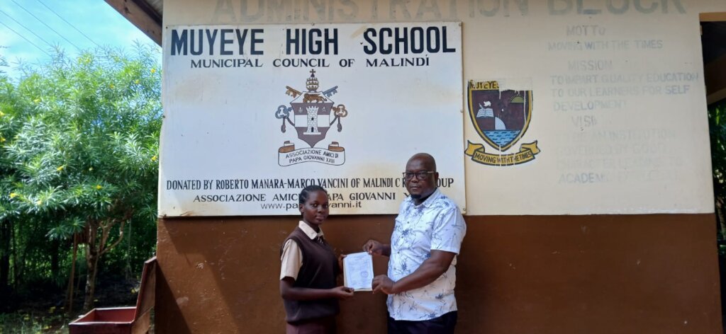 Beneficiary receiving school fees support