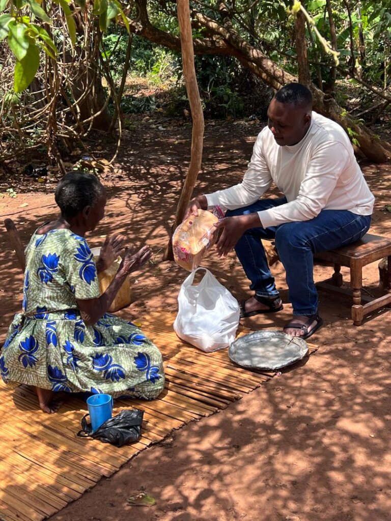 A widow in Bufuula Village, getting a xmas hamper