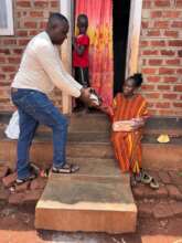 A single mother in Wakalenge Village receiving