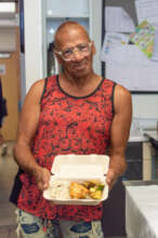 Alliance participant receiving a hot meal