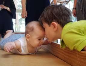 Christian encourages Gabrielle to crawl