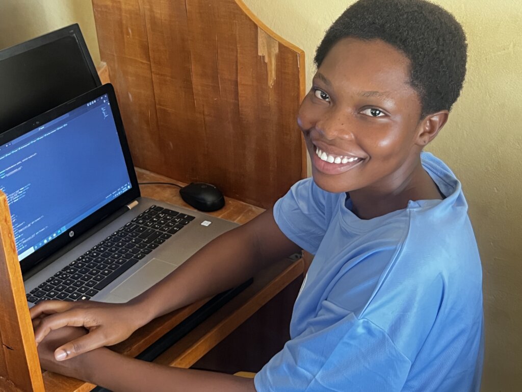 A girl happy to make her first code