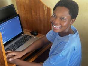 A girl happy to make her first code
