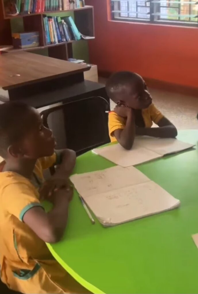 Children receiving reading support after school.