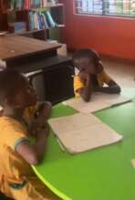 Children receiving reading support after school.