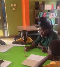Children receiving reading support after school.