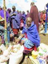 Loan Recipient Selling Goods At Alailelai Market