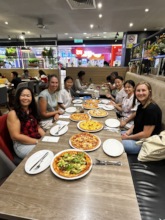 Mentors and students enjoy the final pizza party