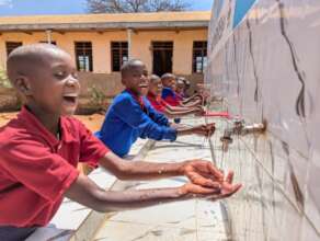 Pupils happily Washing their hands