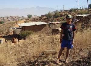 Child in a typical suburban area in Cochbamba