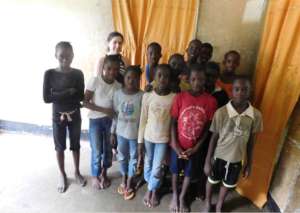 Board member Alexis with kids