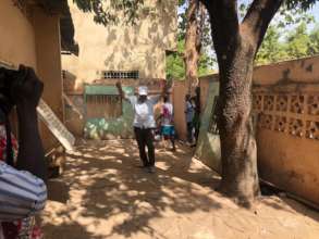 Donor playing soccer with the children