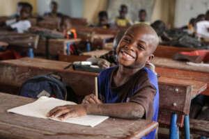 Ousmane* hard at work at school.