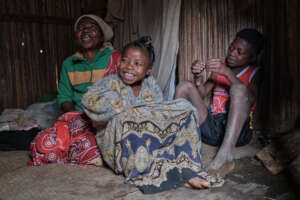 Edmine and her family in their home in Madagascar.