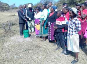 Community Members Opening Tap to Drink Clean Water
