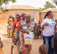 Women Receiving Rice During Food Distribution