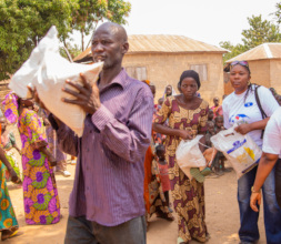 Family man Receiving a Bag of Rice