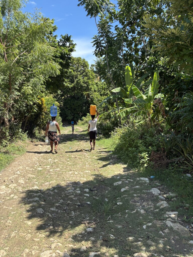 Community members collecting clean water