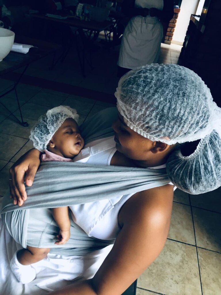 PICTURE OF YOUNG MOM AND HER BABY AT TRAINING