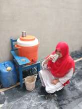 school girl drinking water