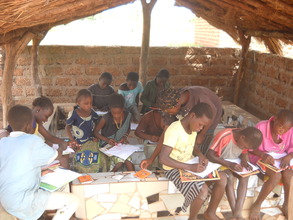 Kids drawing outside of the library