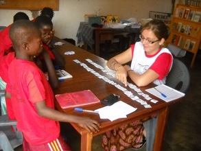 Peace Corps volunteer teaching the Alphabet