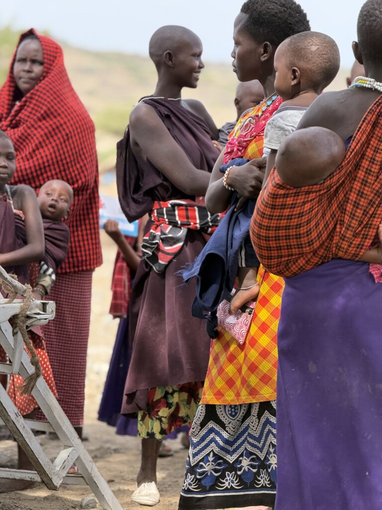 Women and children attend mobile medical clinic