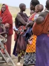 Women and children attend mobile medical clinic